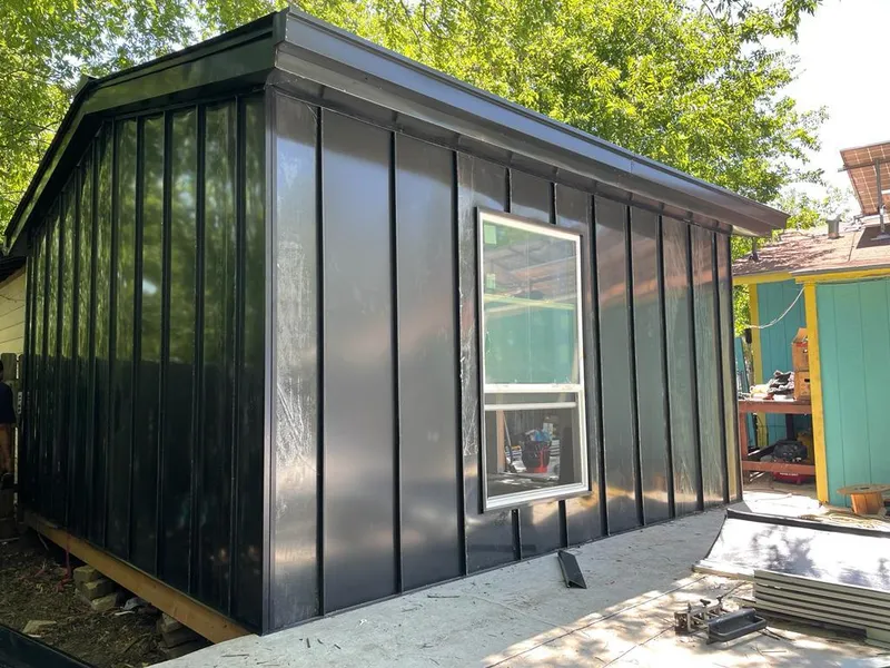 Black standing seam metal wall panels for Roof Inspection in Highland Park